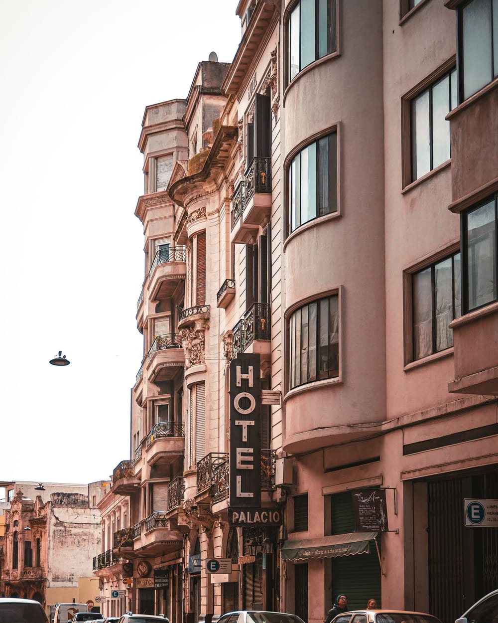 Street of old buildings with a hotel sign